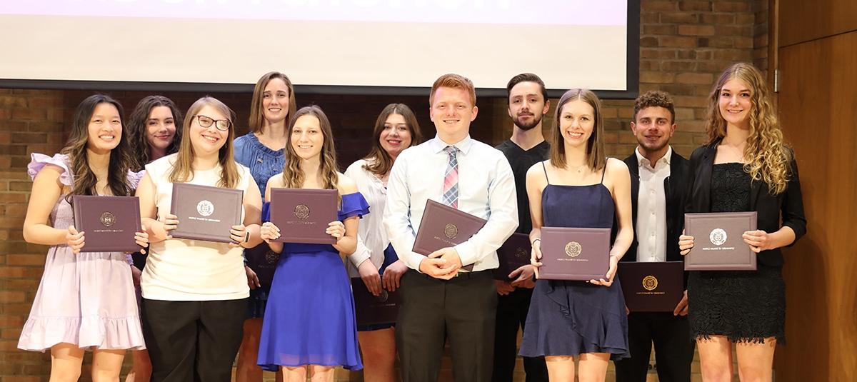 group of honors students receiving certificates